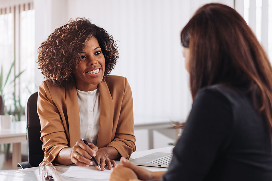 Woman explaining paperwork in an office