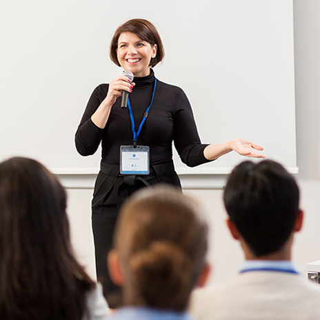 thumbnail of a women giving a lecture to a group of students