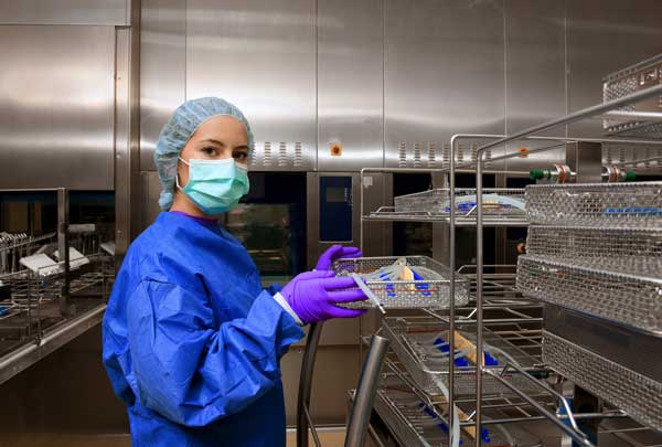 A young woman working in a hospital as a sterile processing technician