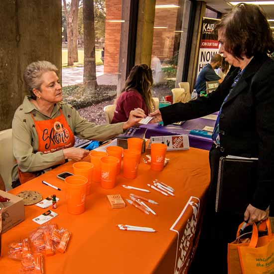 Students talk with potential employers at a job fair