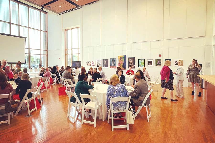 People sitting in an art gallery